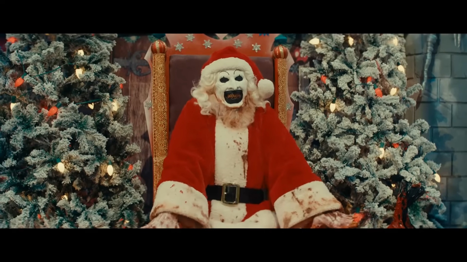 art the clown wears a santa outfit in terrifier 3